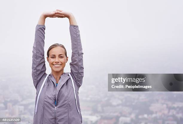 breathing in the morning air - woman stretching arms up stock pictures, royalty-free photos & images