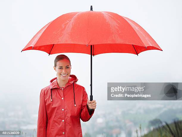 i'm covered no matter what! - holding umbrella stock pictures, royalty-free photos & images