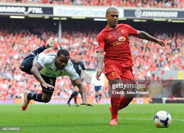 Glen Johnson of Liverpool and Danny Rose of Tottenham Hotspur compete during the Barclays Premier League match between Liverpool and Tottenham...