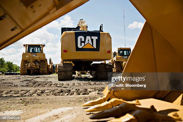Caterpillar Inc. Excavator sits outside the Altorfer Cat dealership in East Peoria, Illinois, U.S., on Tuesday, July 21, 2015. Caterpillar Inc. Is...