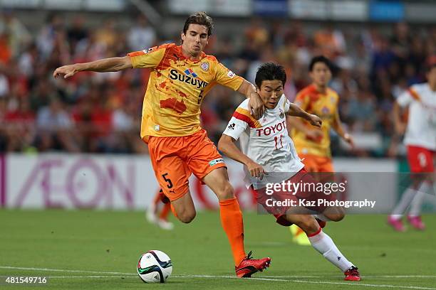 Dejan Jakovic of Shimizu S-Pulse and Kensuke Nagai of Nagoya Grampus compete for the ball during the J.League match between Shimizu S-Pulse and...