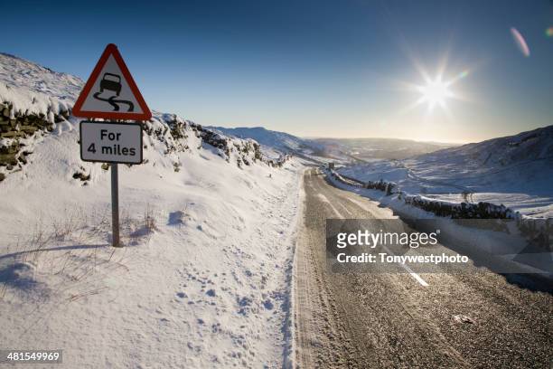 mountain road pass in winter, lake district - varning för halka bildbanksfoton och bilder