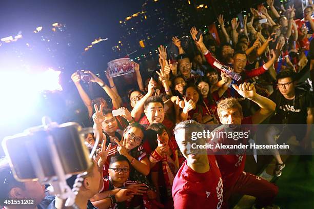 Manuel Neuer of FC Bayern Muenchen and his team mate Thomas Mueller attends a fun football match at adidas marketing event on a cruise boat of the...