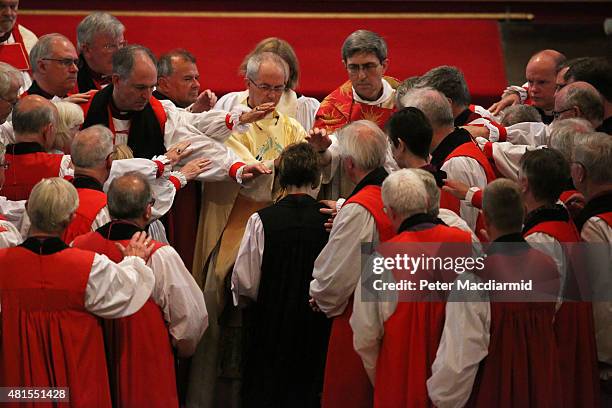 Bishops take part in the ceremonial laying on of hands as the Archbishop of Canterbury, Justin Welby, presides over the consecration of Rachel...