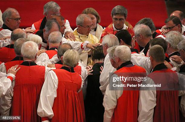 Bishops take part in the ceremonial laying on of hands as the Archbishop of Canterbury, Justin Welby, presides over the consecration of Rachel...