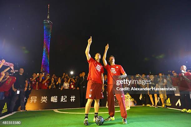 Manuel Neuer of FC Bayern Muenchen and his team mate Thomas Mueller attends a fun football match at adidas marketing event on a cruise boat of the...