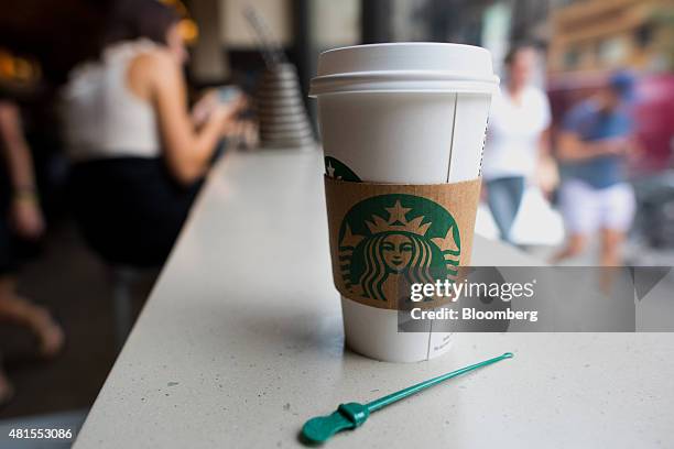 Cup of coffee is displayed for a photograph inside a Starbucks Corp. Location at Union Square in New York, U.S., on Tuesday, July 21, 2015. Starbucks...