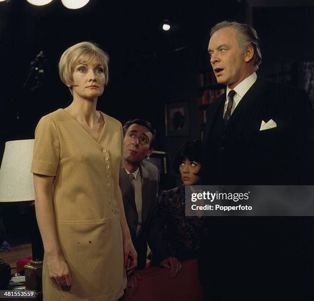 English actress Sheila Hancock pictured with Tony Britton in a scene from the television drama 'Horizontal Hold' in 1968. Behind them are Robert...