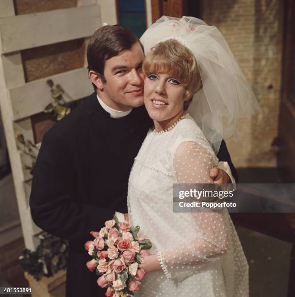 English actress Sue Nicholls as 'Marilyn Gates' and Welsh actor Neville Hughes as 'Rev Peter Hope' in a scene from the long running television soap...