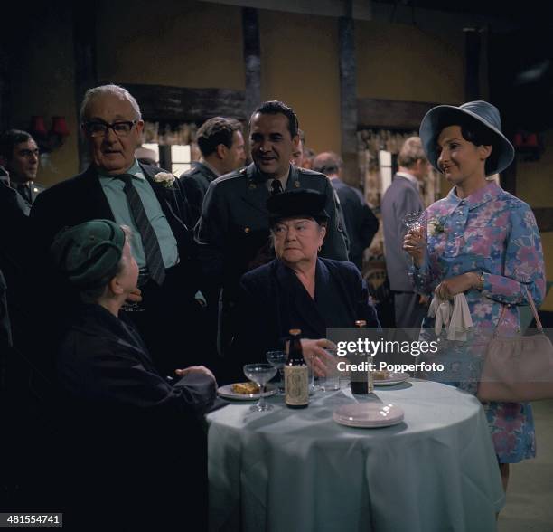 English actress Eileen Derbyshire and Violet Carson pictured in character as Emily Bishop and Ena Sharples in a wedding scene from the long running...