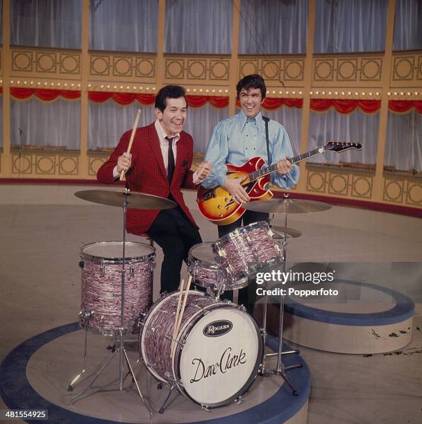 Dave Clark from English pop group The Dave Clark Five posed with American singer and actor Trini Lopez on set of the 'Hippodrome Show' on television...