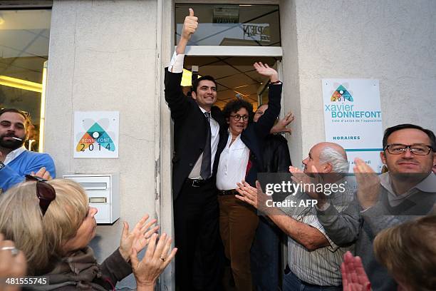 French right wing UMP candidate for the mayoral election in Angouleme, Xavier Bonnefont , celebrates with supporters after the announcement of...