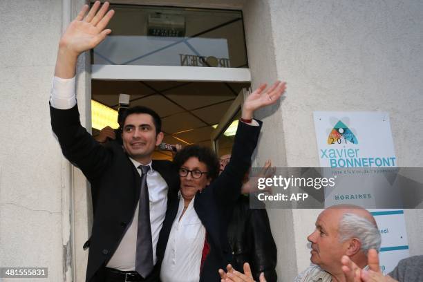 French right wing UMP candidate for the mayoral election in Angouleme, Xavier Bonnefont , celebrates with supporters after the announcement of...