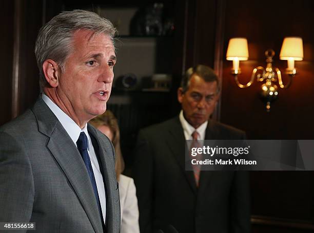 House Majority Leader Kevin McCarthy speaks while flanked by House Speaker John Boehner during a news conference at GOP headquarters on Capitol Hill...
