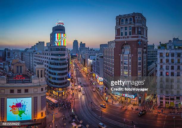 madrid gran via crowded shopping street landmarks illuminated sunset spain - gran vía madrid bildbanksfoton och bilder
