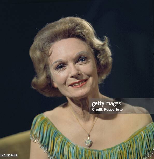 English actress Anna Neagle posed on the set of a television drama production in 1968.