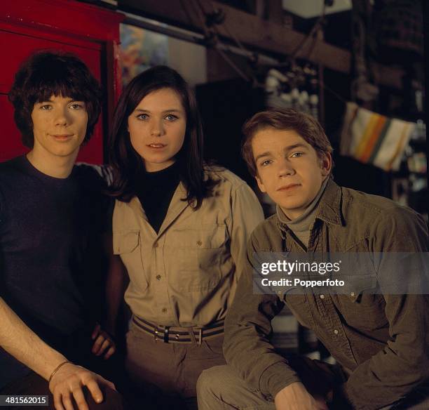 British actress Mary Maude posed with actors Tom Owen and Gregory Phillips on the set of the television series 'Freewheelers' in 1968.