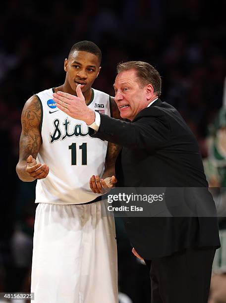 Head coach Tom Izzo of the Michigan State Spartans talks with Keith Appling against the Connecticut Huskies during the East Regional Final of the...