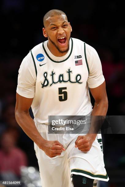 Adreian Payne of the Michigan State Spartans reacts after a basket in the second half against the Connecticut Huskies during the East Regional Final...