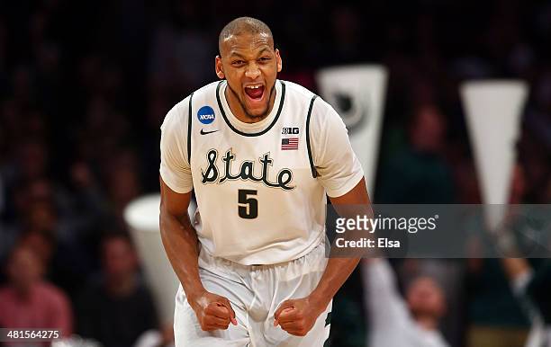 Adreian Payne of the Michigan State Spartans reacts after a basket in the second half against the Connecticut Huskies during the East Regional Final...