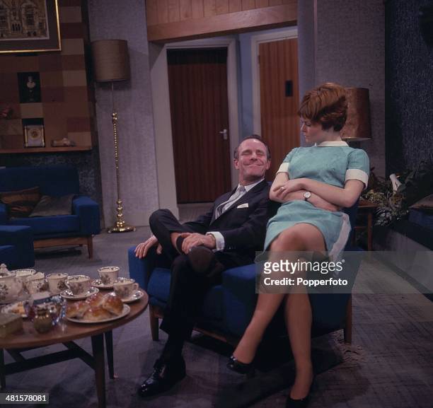 English entertainer Dickie Henderson pictured with actress Isla Blair in a scene from the television sitcom 'The Dickie Henderson Show' in 1968.