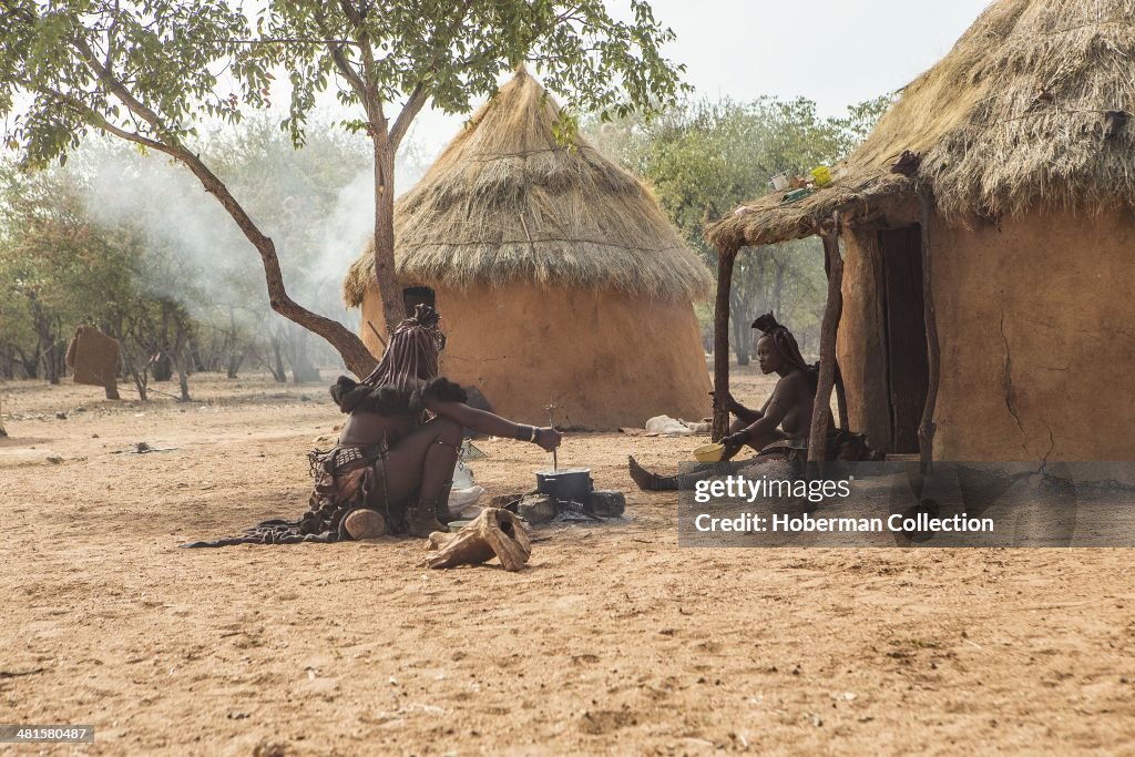 Traditional Himba Huts With Working Tribes Woman