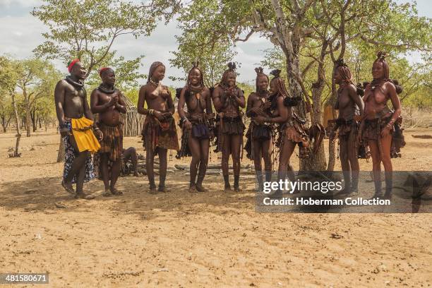 Himba Women Dancing And Clapping Hands At Their Village Near Opuwo. Namibia.