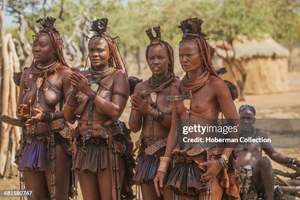 Himba Women Dancing And Clapping Hands At Their Village Near Opuwo. Namibia.