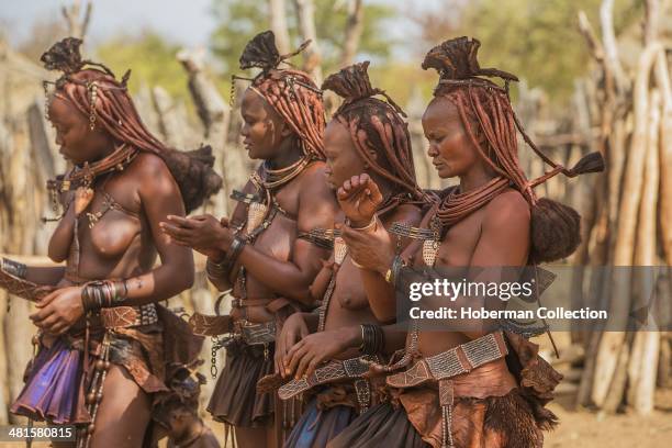 Himba Women Dancing And Clapping Hands At Their Village Near Opuwo. Namibia.