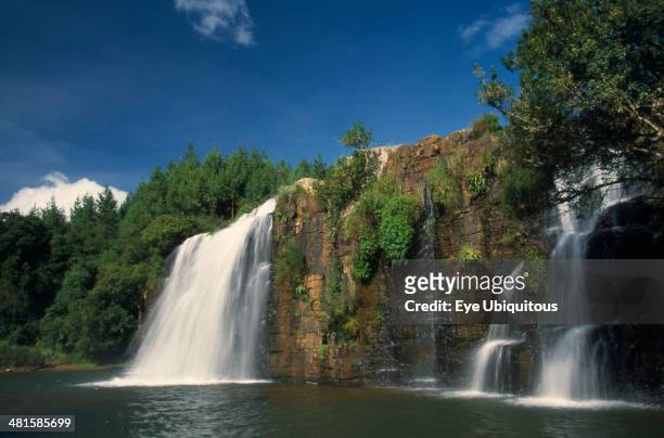 South Africa, Mpumalanga, Forest Falls, Near Grasskop. Waterfall surrounded by rocks and forest.