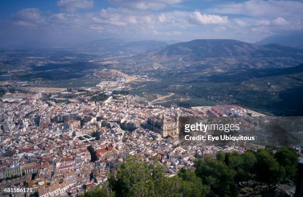 Spain, Andalucia, Jaen Province, View over trees to Jaén with the cathedral in the center and distant hills.