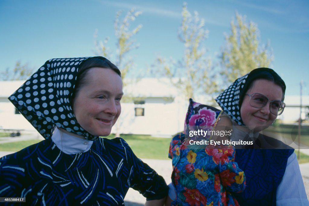 Hutterite women and child from the Milford farming colony