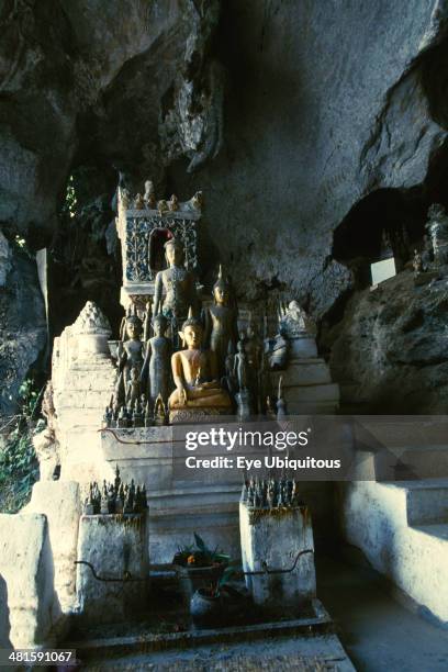 Laos, Luang Prabang Province, Pak Ou, Tham Ting Cave filled with Buddha images.