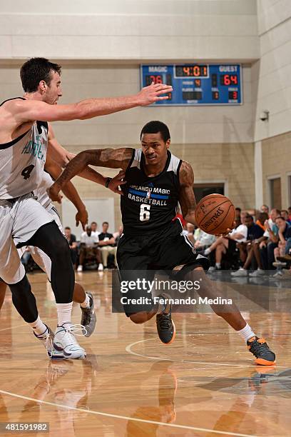 Keith Appling of the Orlando Magic-White dribbles the ball against the Memphis Grizzlies during the Orlando Summer League on July 8, 2015 at Amway...