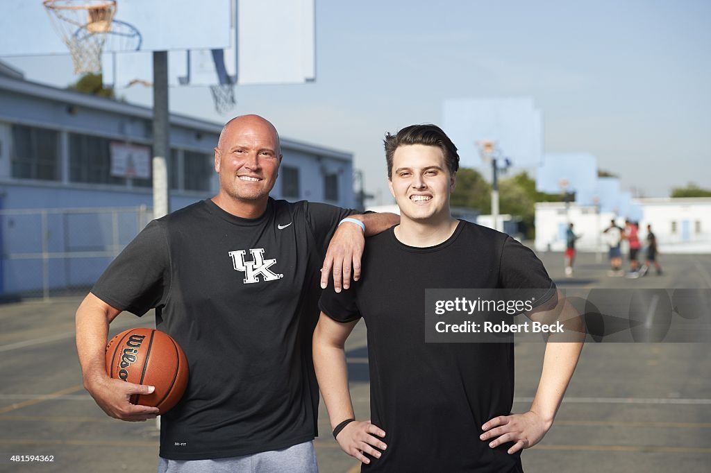 Portrait of former NBA player Rex Chapman with son Zeke during