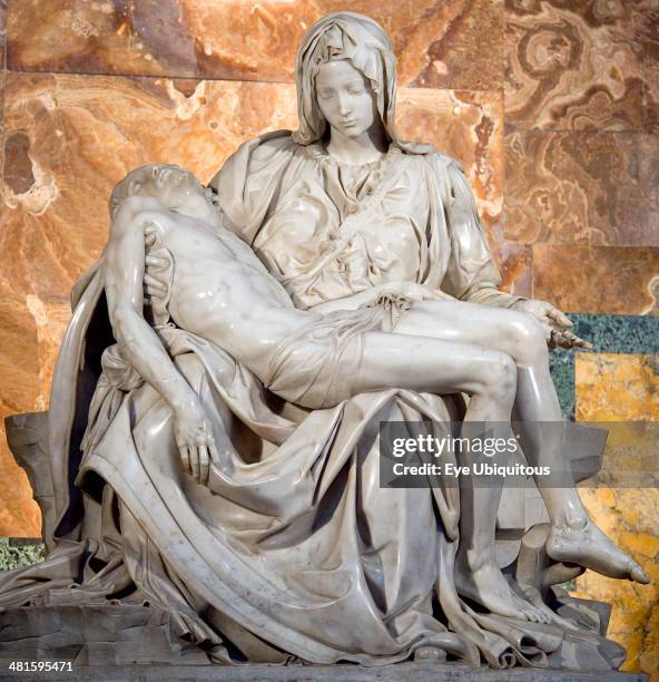 Italy, Lazio, Rome, Vatican City The 1499 Renaissance Pieta by Michelangelo in St Peters Basilica depicting the body of Jesus in the arms of his...