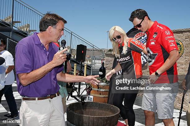 Courtney Force, NHRA's winningest female driver, competes in a grape stomping contest against her fiance, INDYCAR driver Graham Rahal, during a...