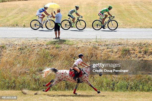 Horseback rider paces Thibaut Pinot of France riding for FDJ, Rafal Majka of Poland riding for Tinkoff-Saxo and Peter Sagan of Slovakia riding for...