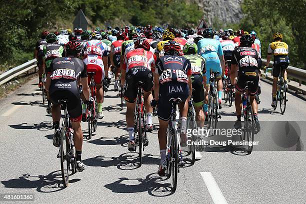 Riders hang on at the back of the peloton during stage 17 of the 2015 Tour de France from Digne-Les-Bains to Pra Loup on July 22, 2015 in...