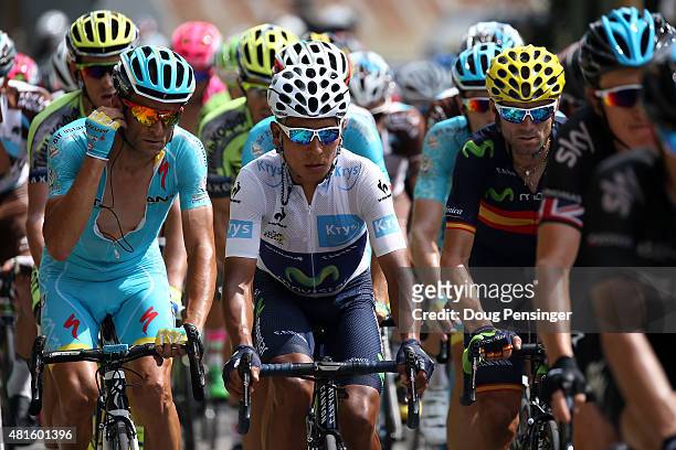 Nairo Quintana of Columbia riding for Movistar Team defends the best young rider white jersey as he rides in the peloton with teammate Alejandro...