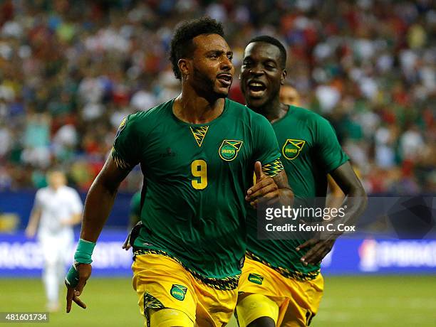 Giles Barnes of Jamaica celebrates scoring the second goal against the United States of America with Je-Vaughn Watson during the 2015 CONCACAF Golf...