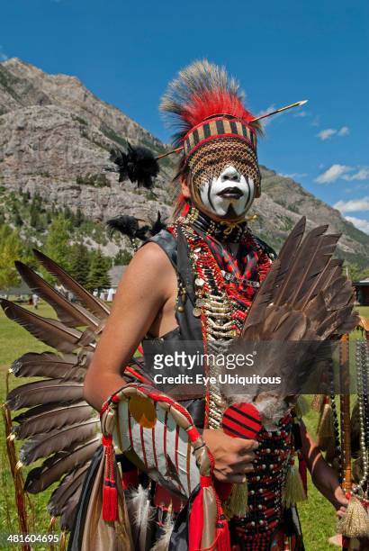 Canada, Alberta, Waterton Lakes National Park, Blackfoot head dancer Aryson Black Plume in full regalia and face paint at Blackfoot Arts and Heritage...