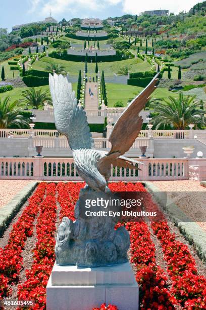 Israel, Northern Coast, Haifa, Zionism Avenue Eagle sculpture set in flower bed of the Baha'i gardens with view