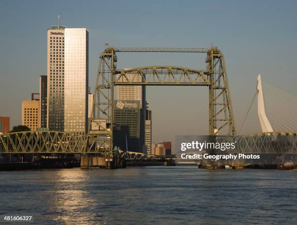 Early morning sunshine on the River Maas and de Hef railway bridge, Koningshaven, Rotterdam, Netherlands.