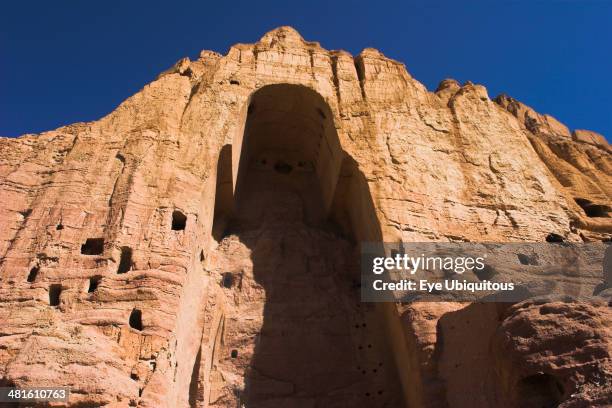 Empty niche in cliffs where famous carved large Buddha once stood 180 foot high before being destroyed