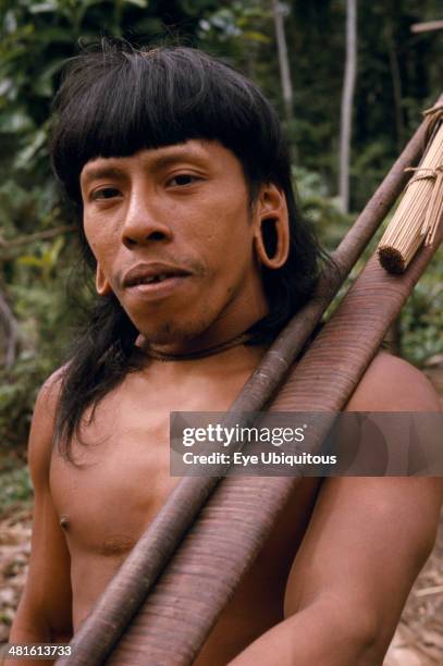Ecuador, Amazon, People, Waorani Indian hunter with blow gun.