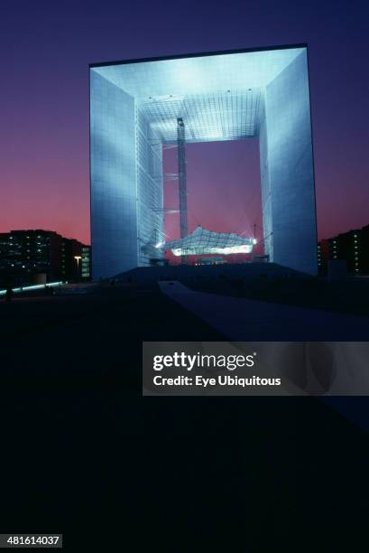 France, Ile De France, Paris, La Grande Arche at La Defence illuminated at night.
