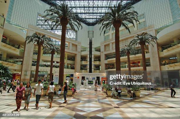 Singapore, Raffles City, Interior Of A Shopping Centre With Palm Trees.