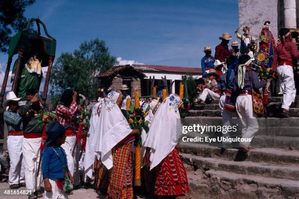 Guatemala, El Quiche, San Andres de Sajcabaja, Quiche Indians carrying a statue of the Patron Saint in procession up the church steps during San...