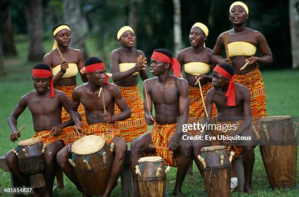 Ghana, Accra, Tribal drummers dressed in Kente cloth. Near Accra.